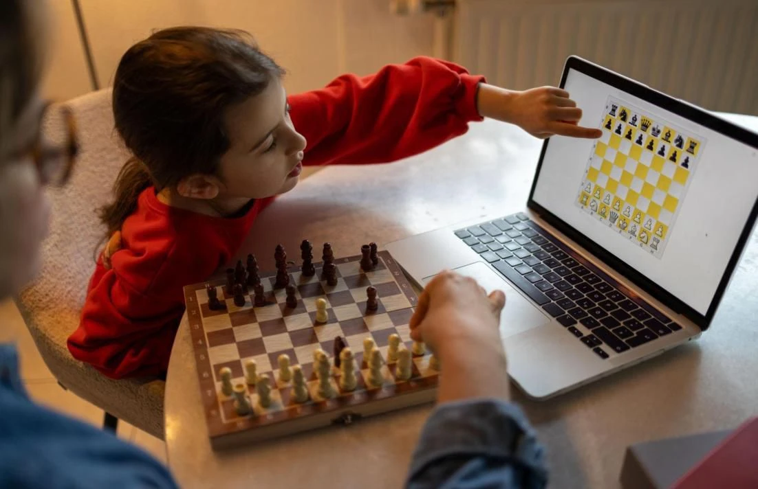 A young student solving puzzles at home as part of a structured chess training program.